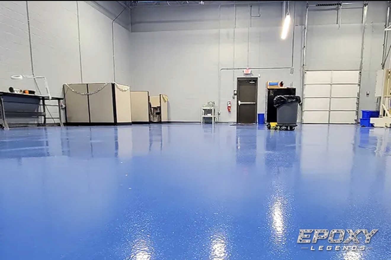 Blue epoxy floor coating in a Connecticut industrial warehouse space