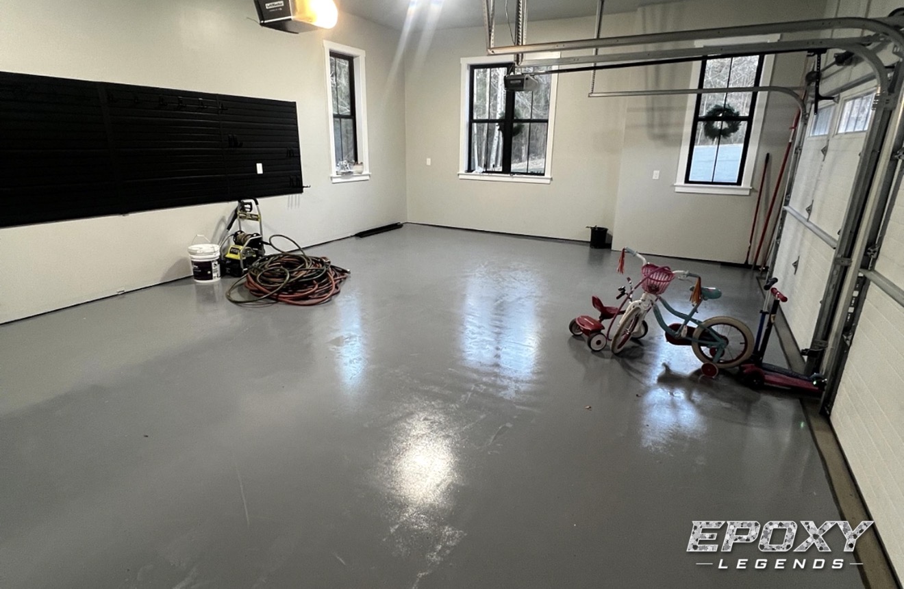 Gray solid color epoxy garage floor coating in a residential Connecticut garage