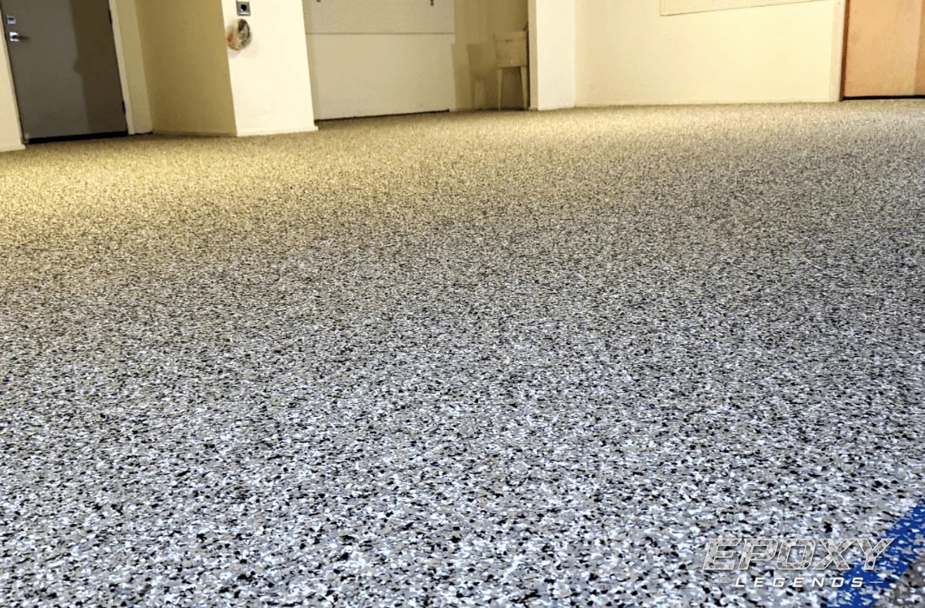 Tan and black flake epoxy floor coating in a commercial hallway in Connecticut